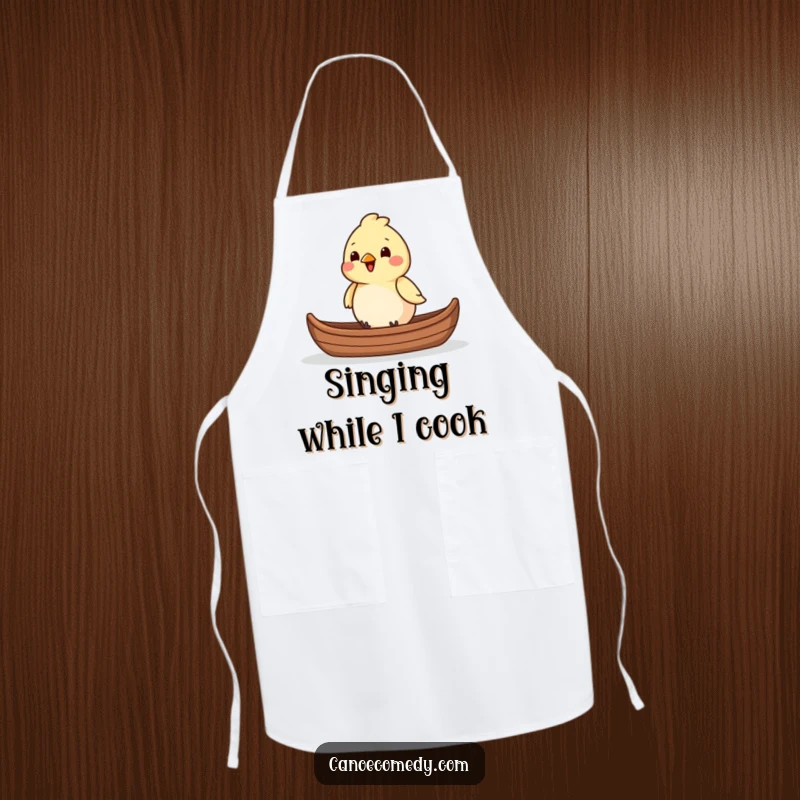 Funny chirpy bird sitting in the front of a canoe while cooking, making it a humorous apron and a funny gift.