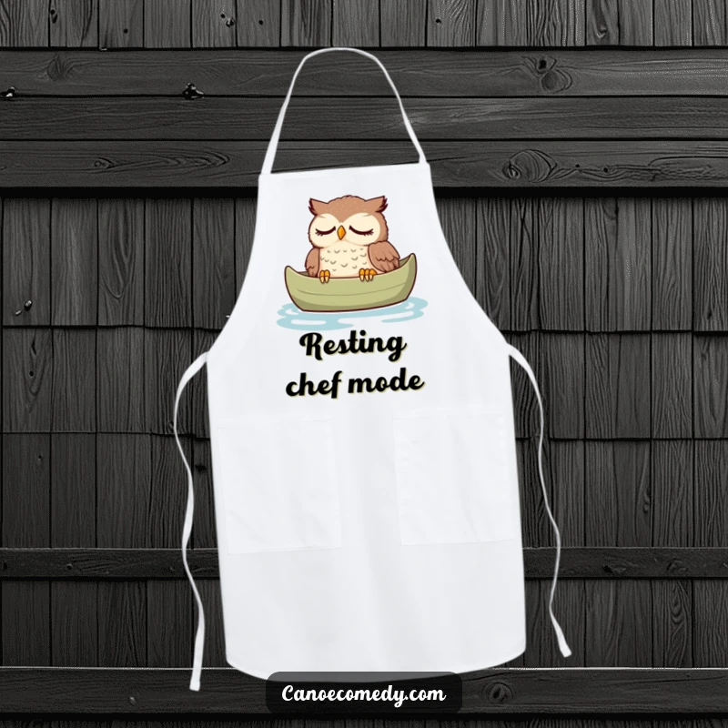 Funny owl apron, depicted peacefully dozing in a canoe, a humorous and practical culinary accessory for relaxation.