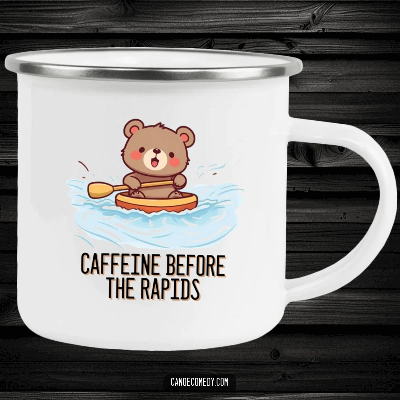 Funny enamel camping mug showcasing a bear joyfully paddling a canoe down a river, ideal for outdoor enthusiasts.