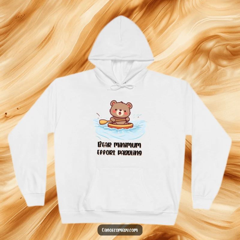 Funny bear hoodie showing a bear enthusiastically paddling a canoe in a wild river, capturing the essence of joyful adventure.