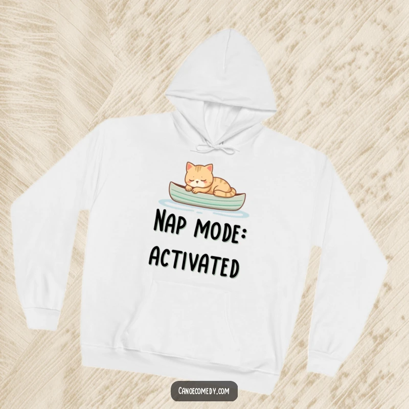 Funny cat sleeping peacefully in a small canoe, cozy and comfortable hoodie for ultimate relaxation and humorous appeal.
