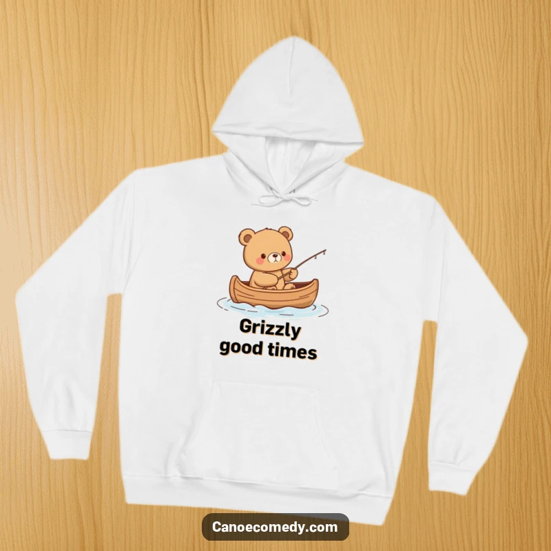 Funny Kawaii Bear Hoodie: Content bear fishes from a canoe, offering warmth and humorous serenity.