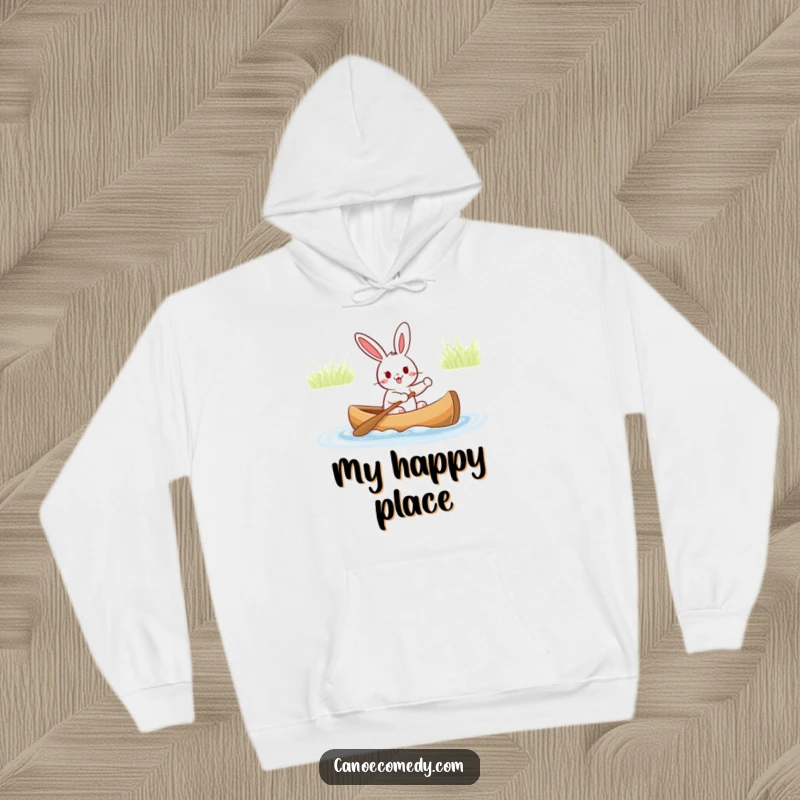Funny hoodie featuring an excited rabbit captaining a canoe, ready for a cozy and humorous outdoor experience, perfect for cold weather.