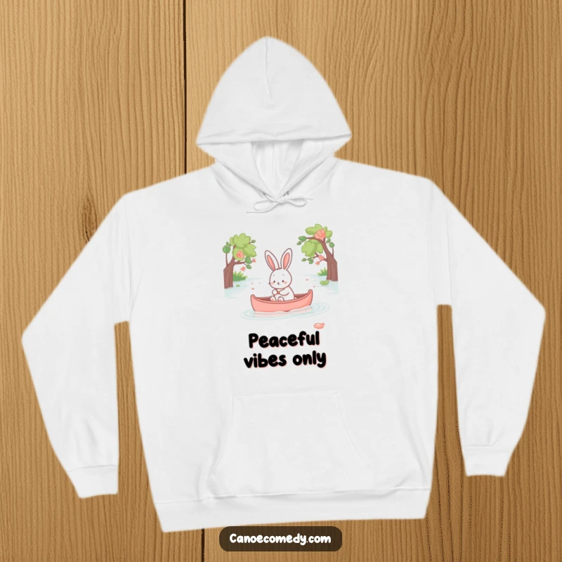 Funny kawaii rabbit enjoying a peaceful canoe ride, soft and cozy hoodie design, adorable animal graphic.