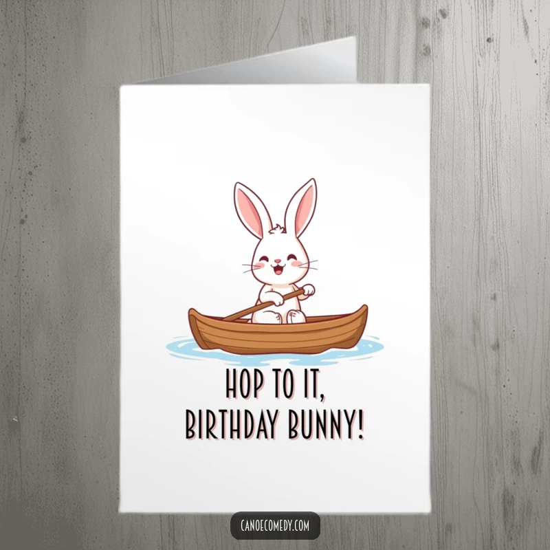 Funny Free Printable Birthday Card: A cheerful rabbit with large ears happily paddling a canoe, perfect for a unique birthday greeting.