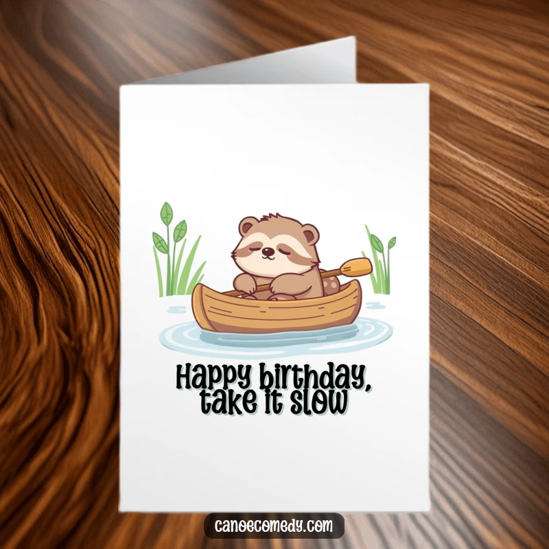 Funny Free Printable Birthday Card: A peaceful sloth napping in a canoe, slowly drifting down a calm river.
