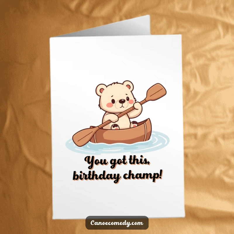 Funny Free Printable Birthday Card: A focused bear cub paddling a canoe with all its might to reach a goal.