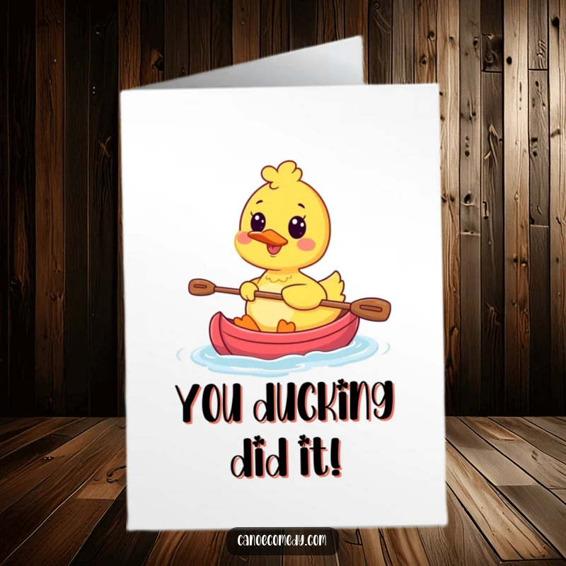 Funny free printable congratulations card featuring a kawaii duck happily paddling a mini canoe with a wide, celebratory smile.