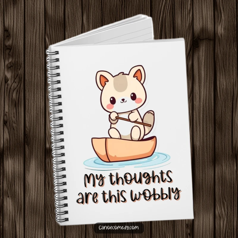 Funny Kawaii animal character in a canoe, looking unsteady, shown on the cover of a notebook.