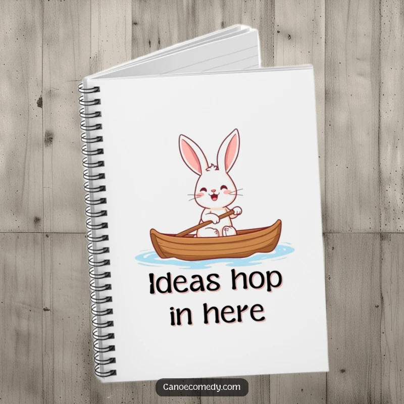 Funny squirrel notebook with a depiction of a cheerful rabbit with big ears paddling a canoe, encouraging happy notes.