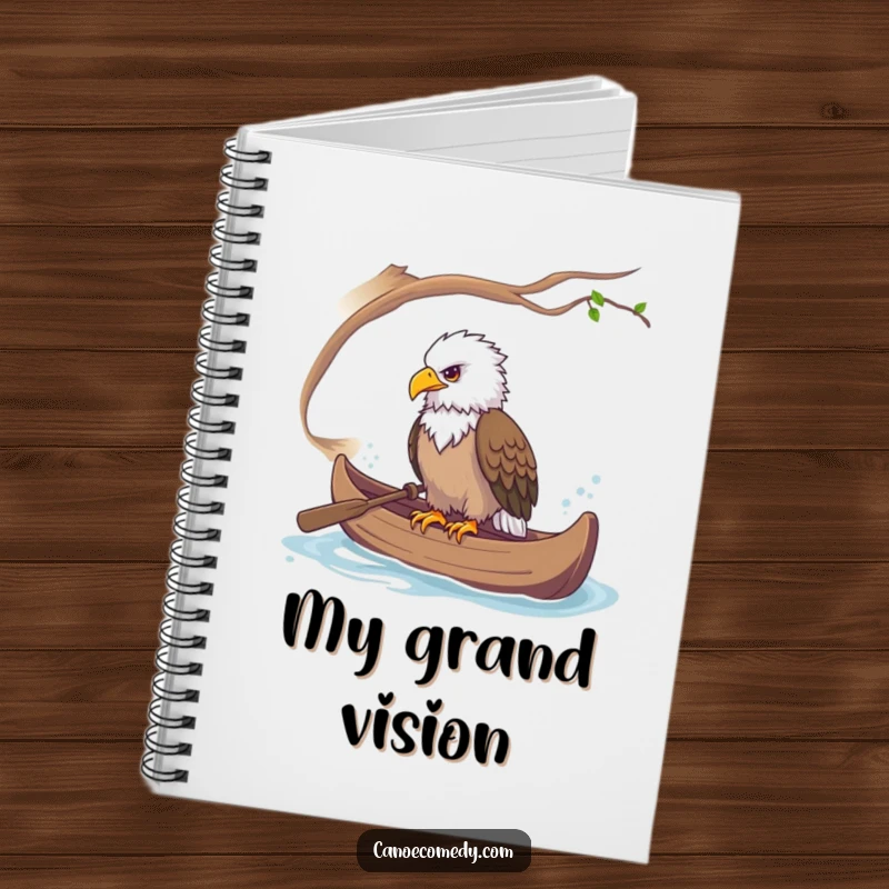 Funny notebook cover featuring a majestic eagle perched in a canoe, ready to observe and record.