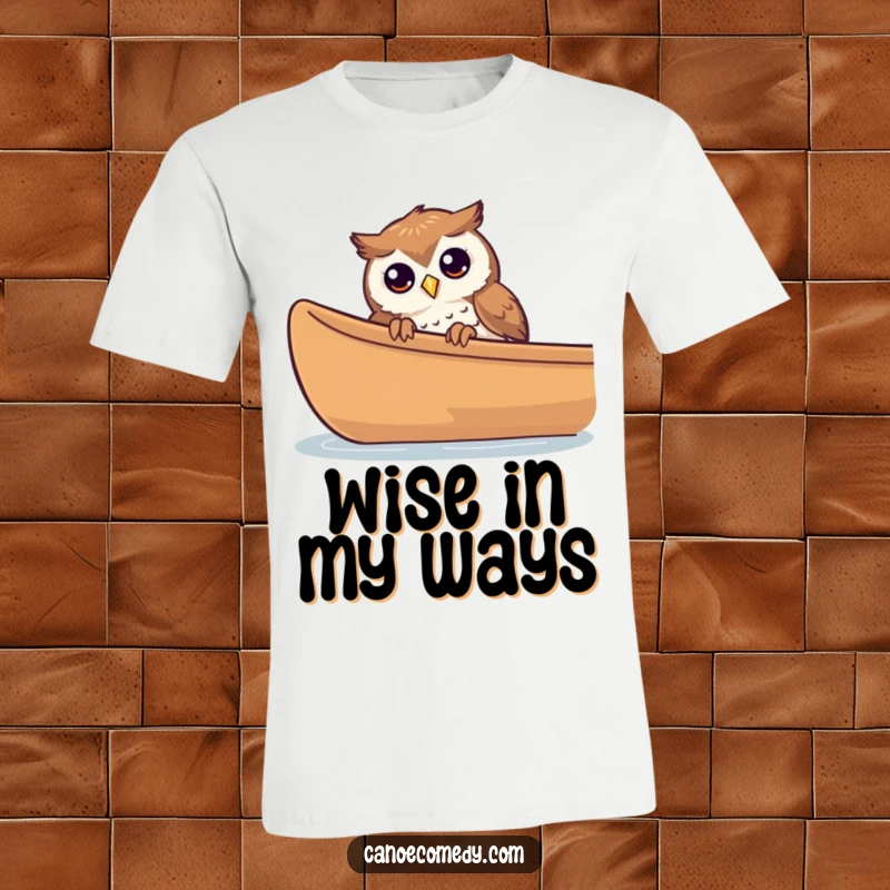 Funny curious owl peeking over the side of a canoe on a t-shirt, highlighting observation and fun.