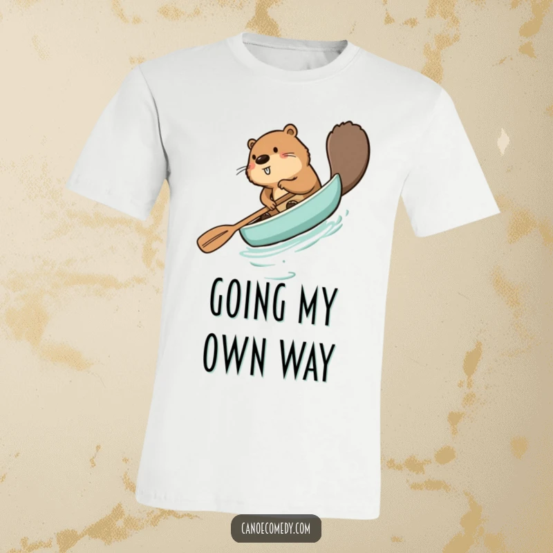 Funny beaver t-shirt, comically paddling a canoe backward with a determined yet confused expression, perfect for outdoor lovers.