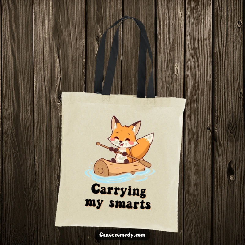 Funny tote bag featuring a beaming fox navigating a log canoe with expert precision, great for stylish and humorous errands.