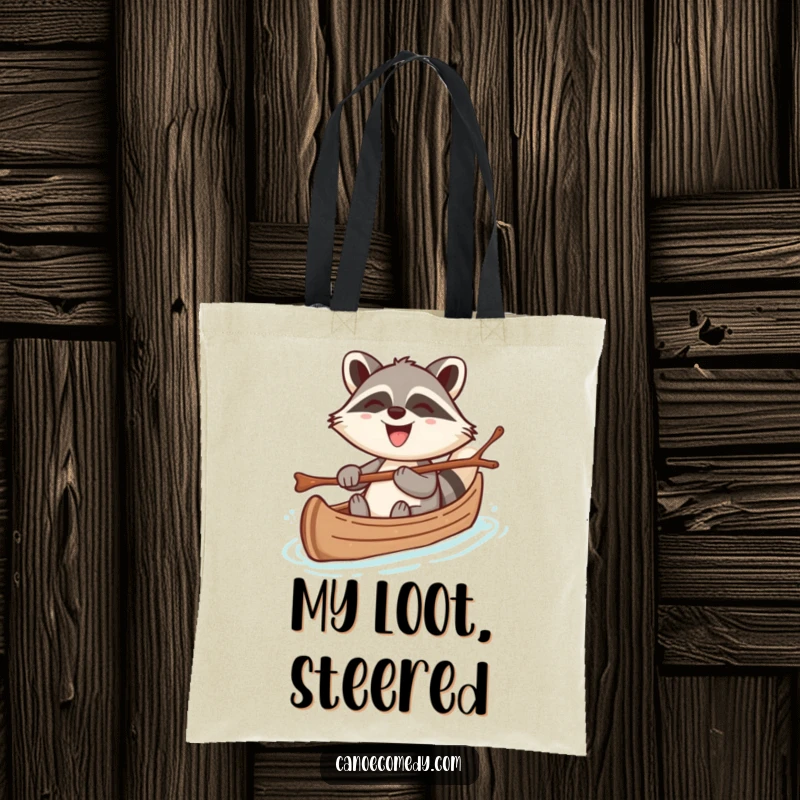 Funny tote bag featuring a cheerful kawaii raccoon steering a canoe with a twig, grinning broadly, perfect for humorous, practical use.